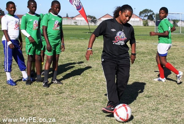 Banyana Banyana Player Desiree Ellis and learners from Vuyani Primary