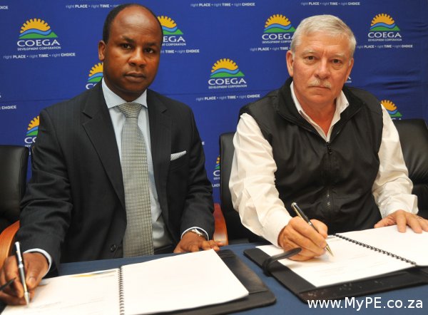 Signing the MOU are CDC's business development executive manager, Chris Mashigo and Department of Education representative Raymond Beukes.