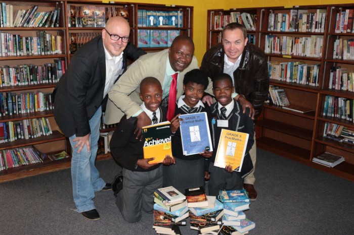 From top left is Mr. Lunga Dyani (Principal of Walmer High School) and Dave Tiltmann (Managing Director of Algoa FM) with Walmer High School library prefects from bottom left is Samkelo Koli (gr 11), Banathi Adams (gr 11) and Anathi Mqongwana (gr 10)