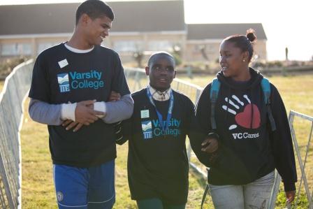 Varsity College students Shaun and Keziah assisting Bangile from the Nkosinathi Foundation at the 2014 Blind Fun Run
