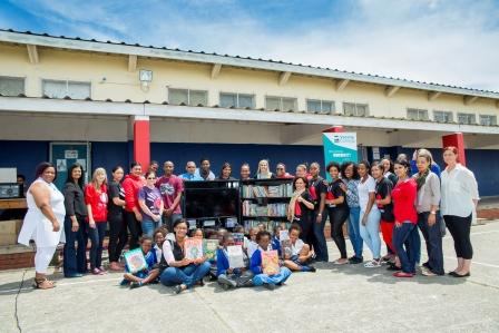 Varsity College staff and students along with Adolph Schauder Primary School Foundation Phase teachers and students celebrating the opening of the mobile library unit