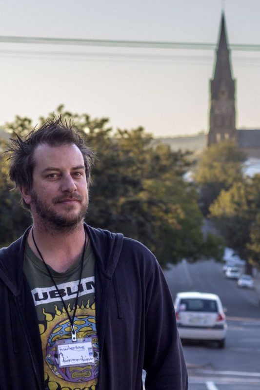 Director Rob Murray waits outside the NG Kerk Hall before the dress rehearsal of his new mask work Waterline, at the National Arts Festival.(Photo: CuePix/Mia van der Merwe)