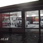 Rain Water laps the entrance to Daihatsu