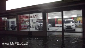 Rain Water laps the entrance to Daihatsu